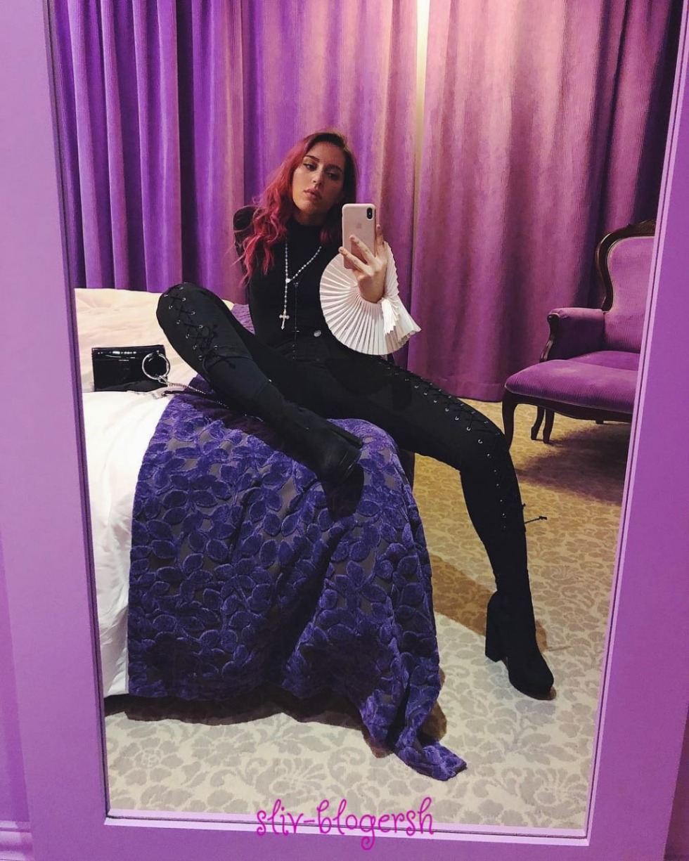 Katya Clam in a swimsuit that holds the stomach