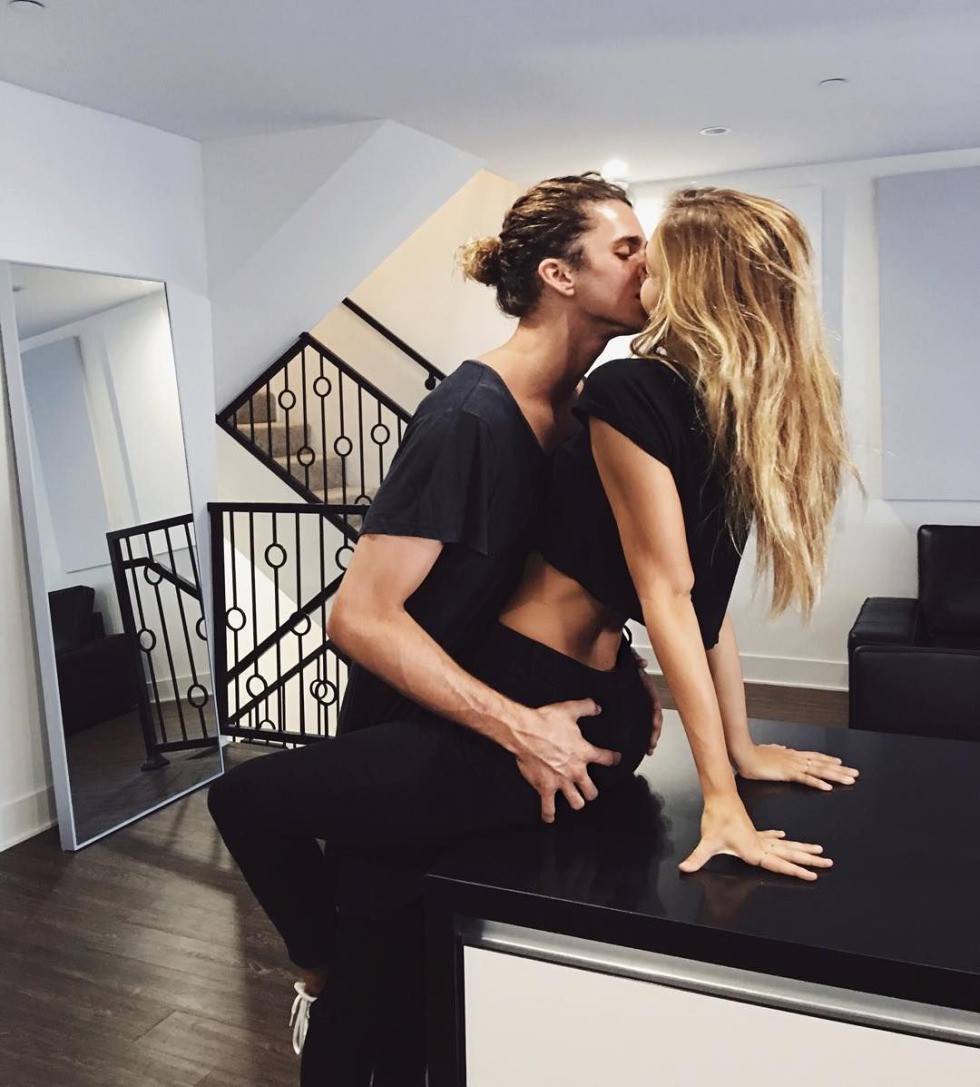 The girl hugs her legs