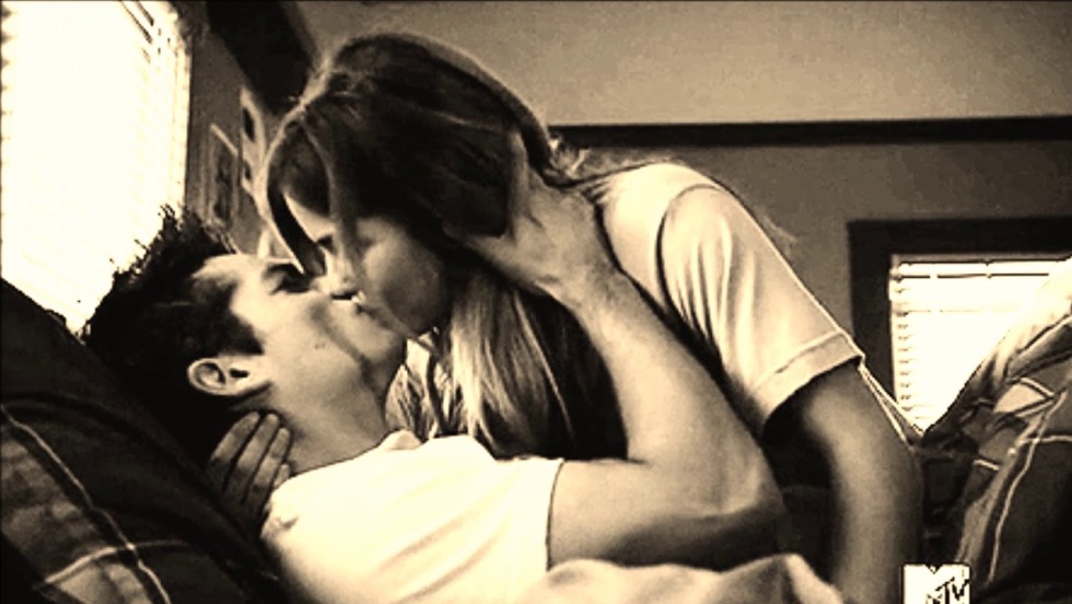 A woman carries a man