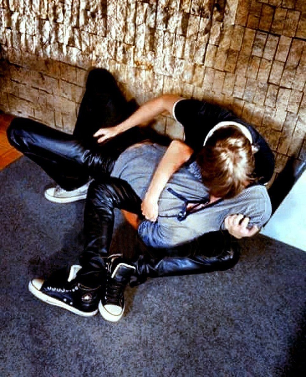 With a stick on nettles