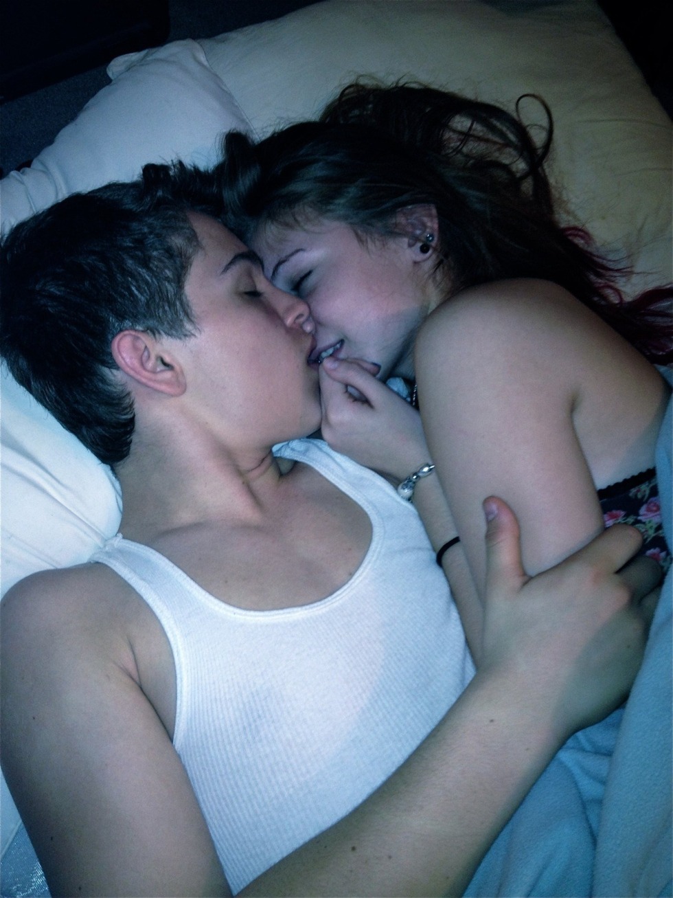 A couple of teenagers in bed