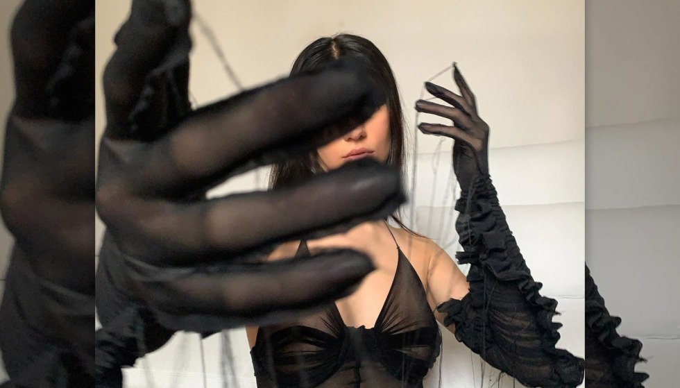 Girl in large gloves to the elbow sexy