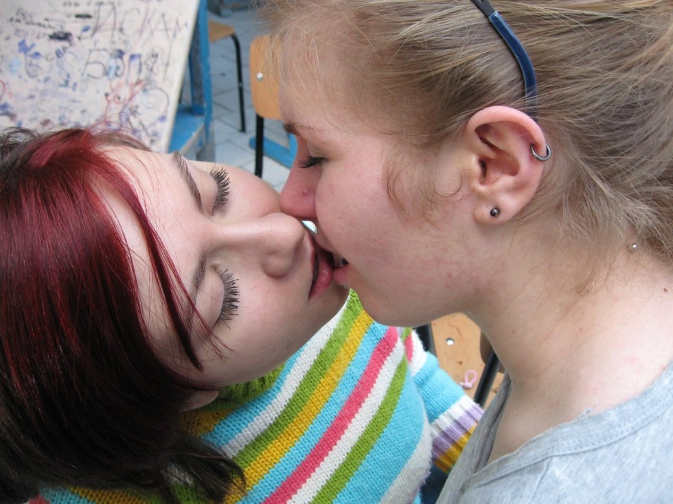 Big breasts in a swimsuit on the beach amateur