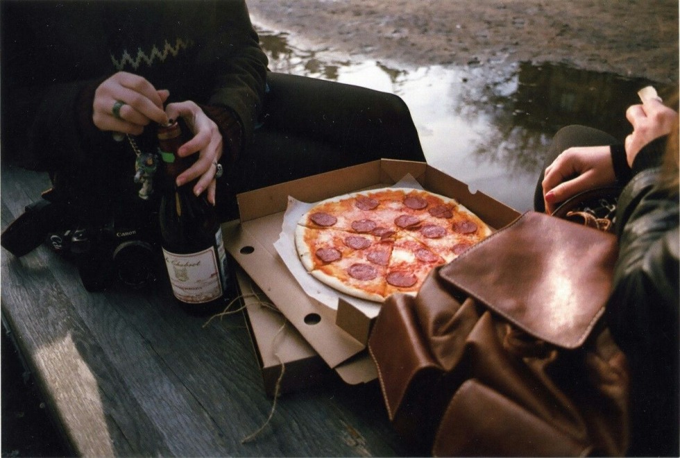 Girl with pizza and wine