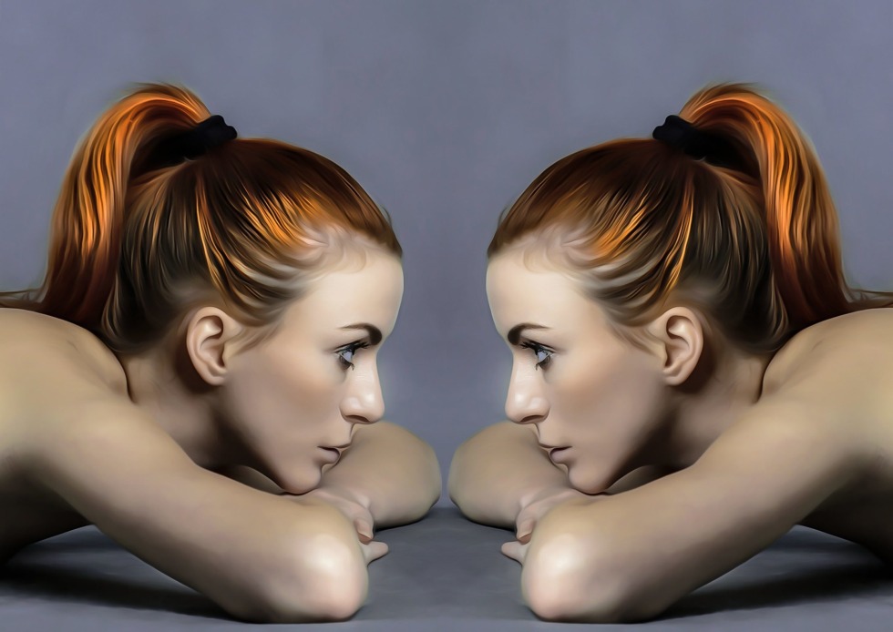 Two girls with a tongue