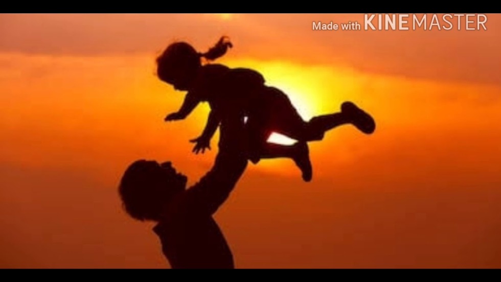 Dad with daughter from back