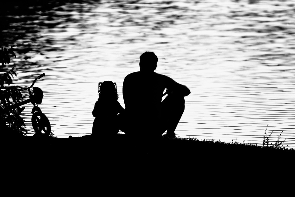 Father and daughter at sunset