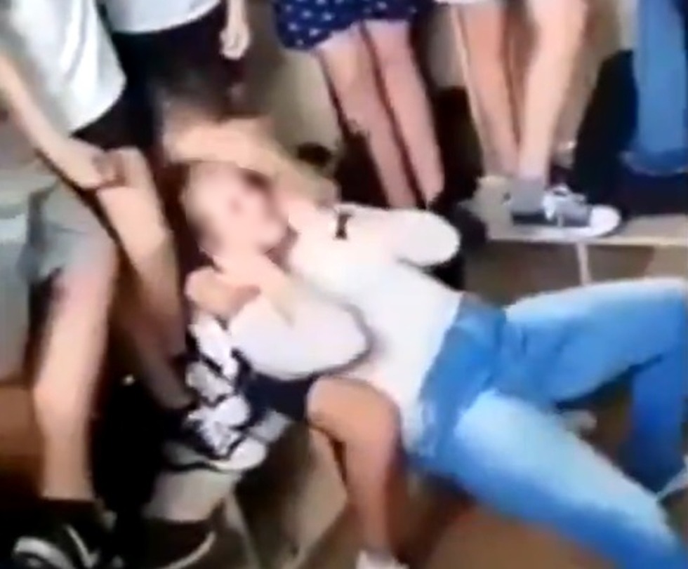 The schoolgirl was divided in the classroom