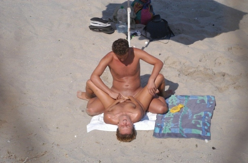 Drunk naked men on the beach