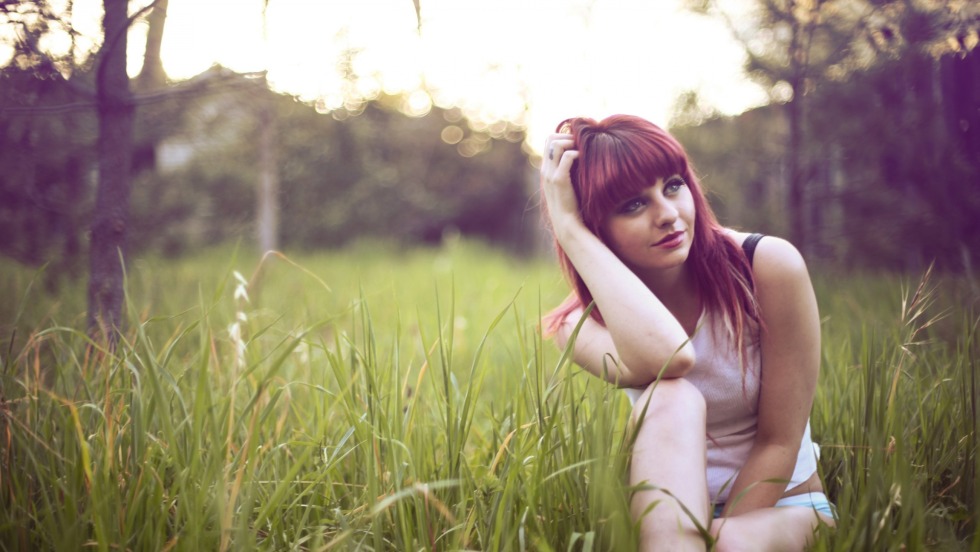 Barefoot Girl Lying on the Grass