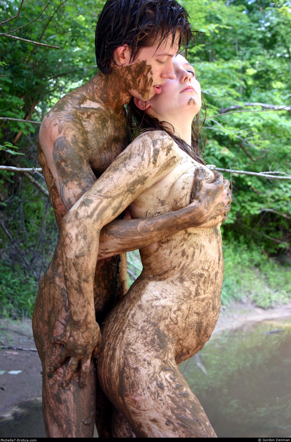 Naked women bathe in mud