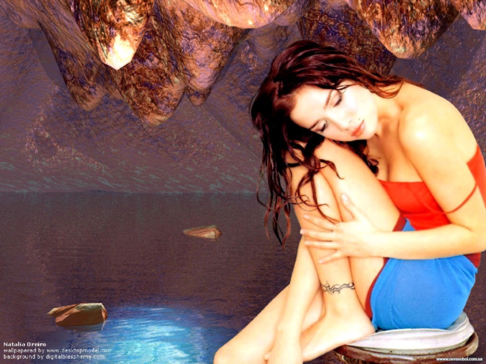 Natalia Oreiro in a white coat on the stairs