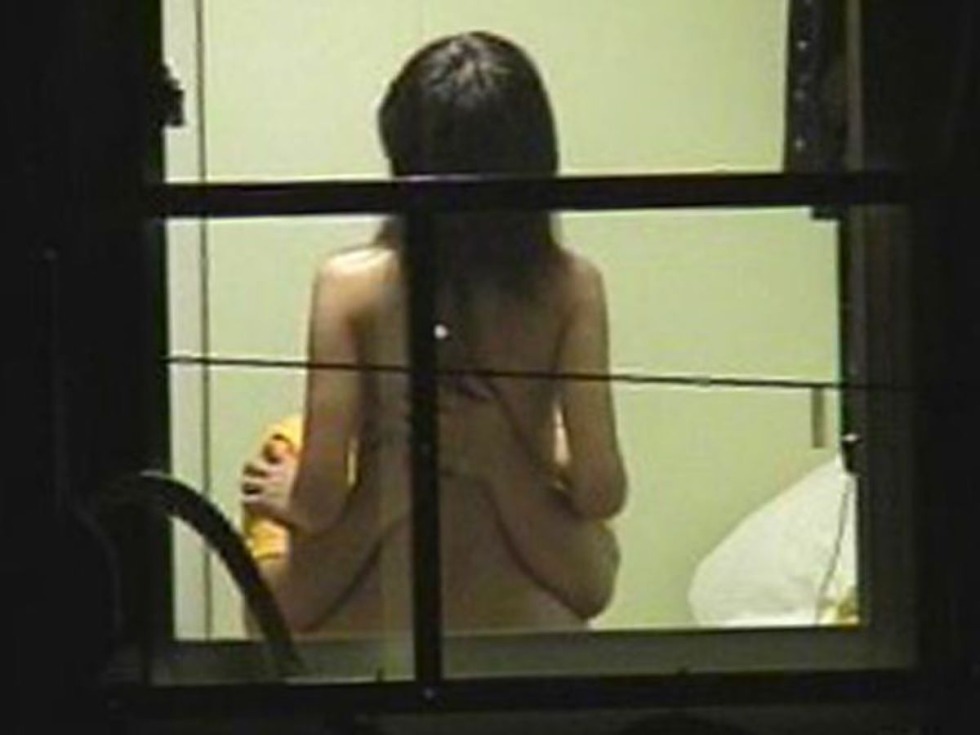 Naked women in the windows of houses