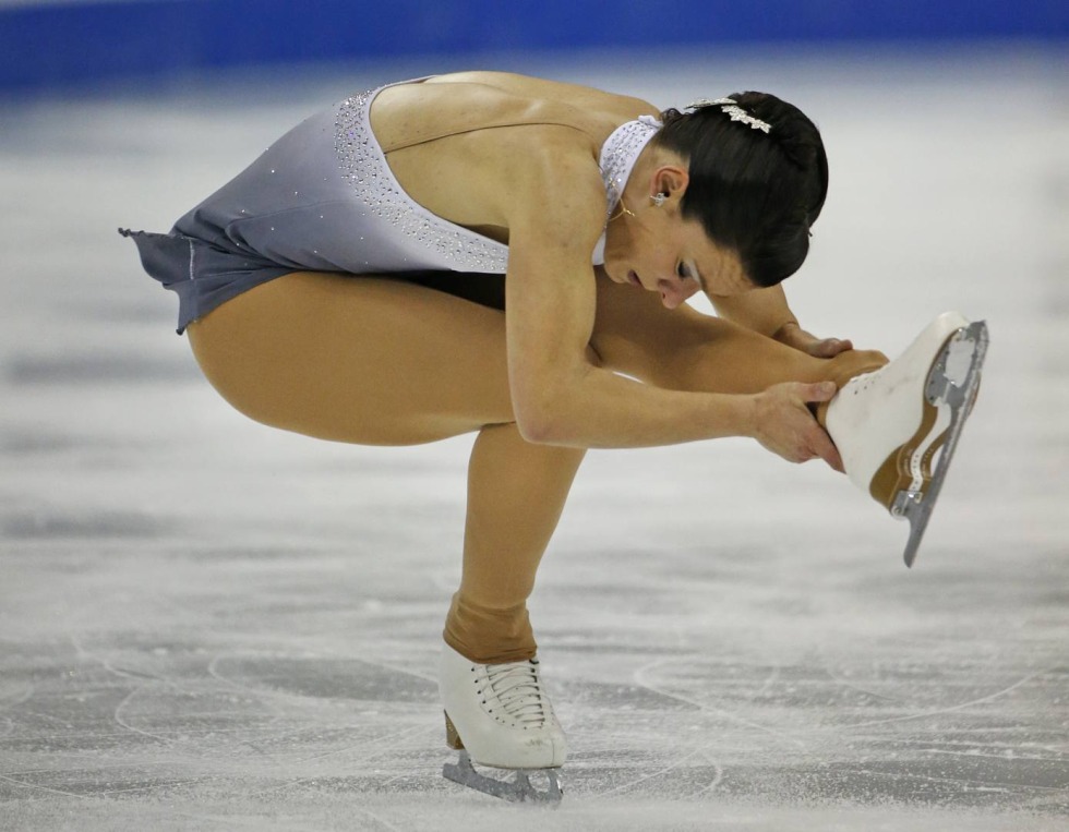 Evgenia Medvedev lies on ice