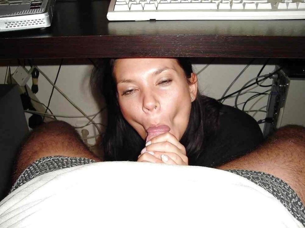 The girl sucks under the table