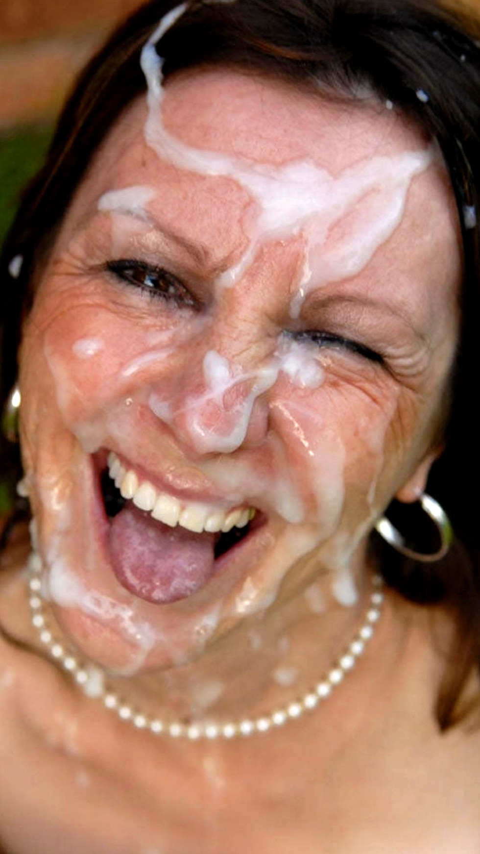 Cum on the face of a mature milf