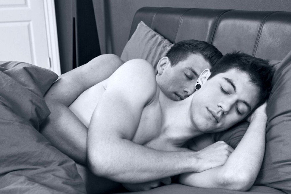 Two men in bed