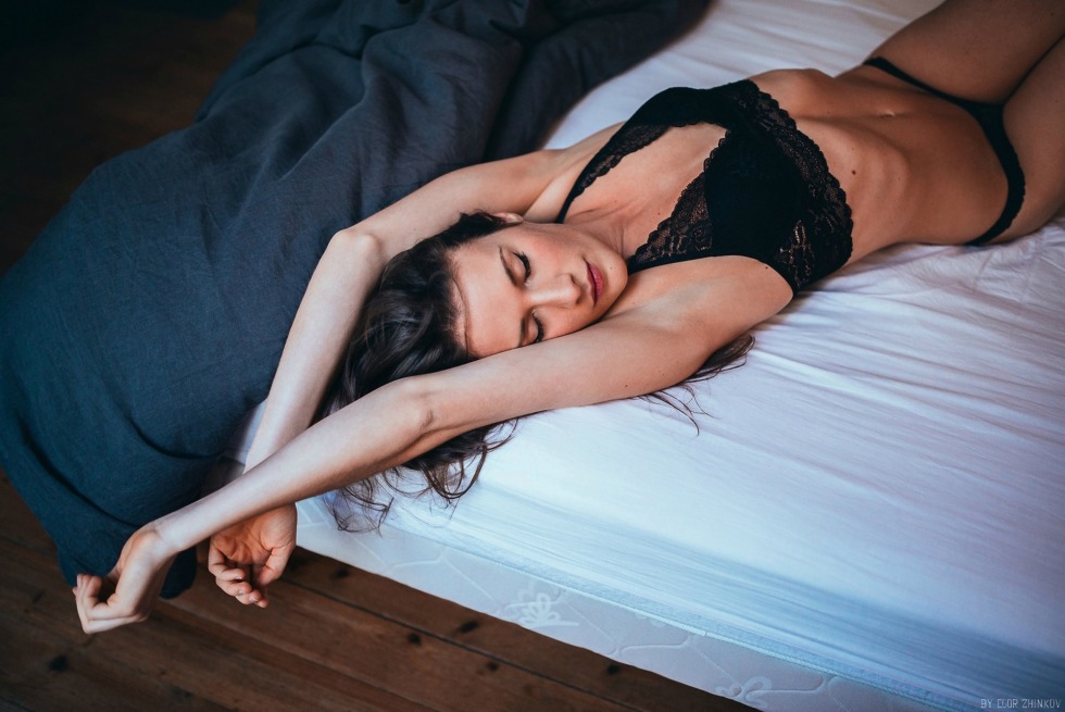 The girl lies on her back