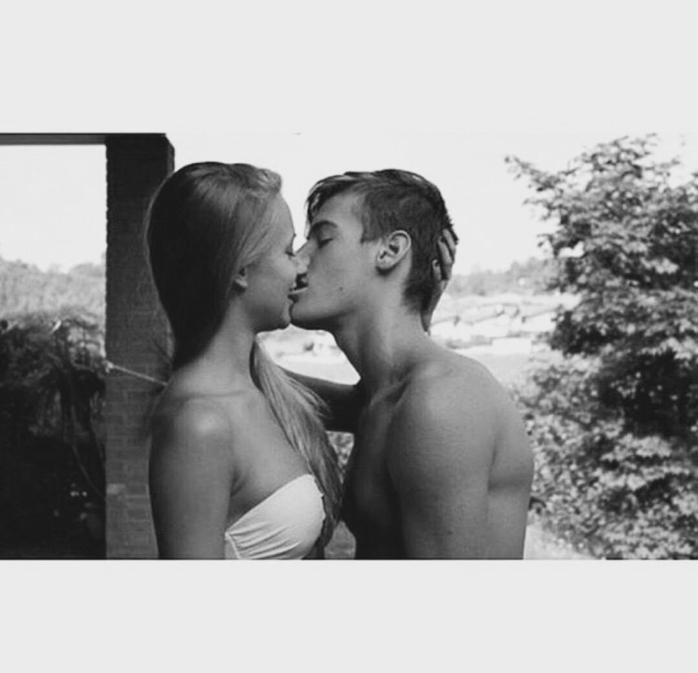 Passionate kiss on the couch