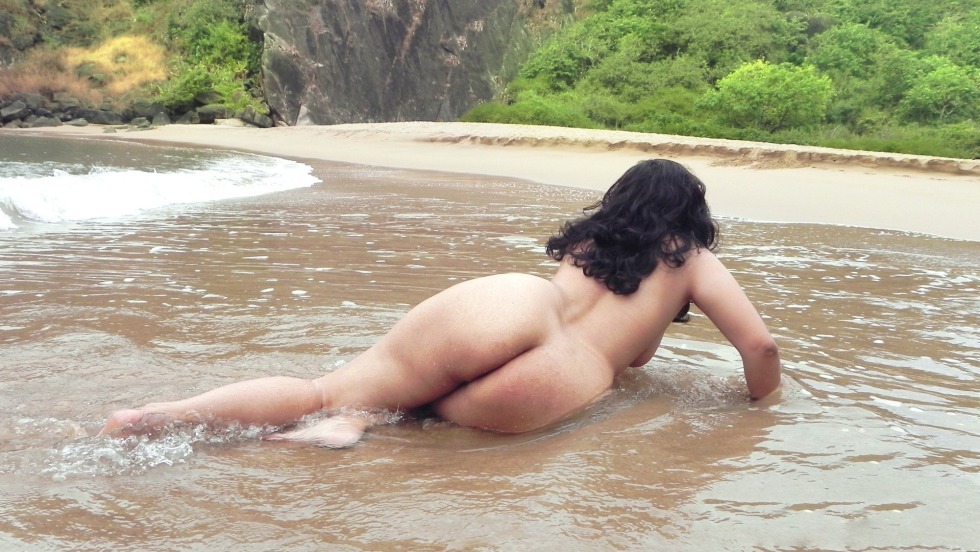 Naked women bathe in the river