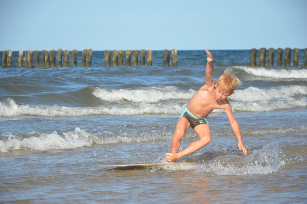 An elderly couple is a house