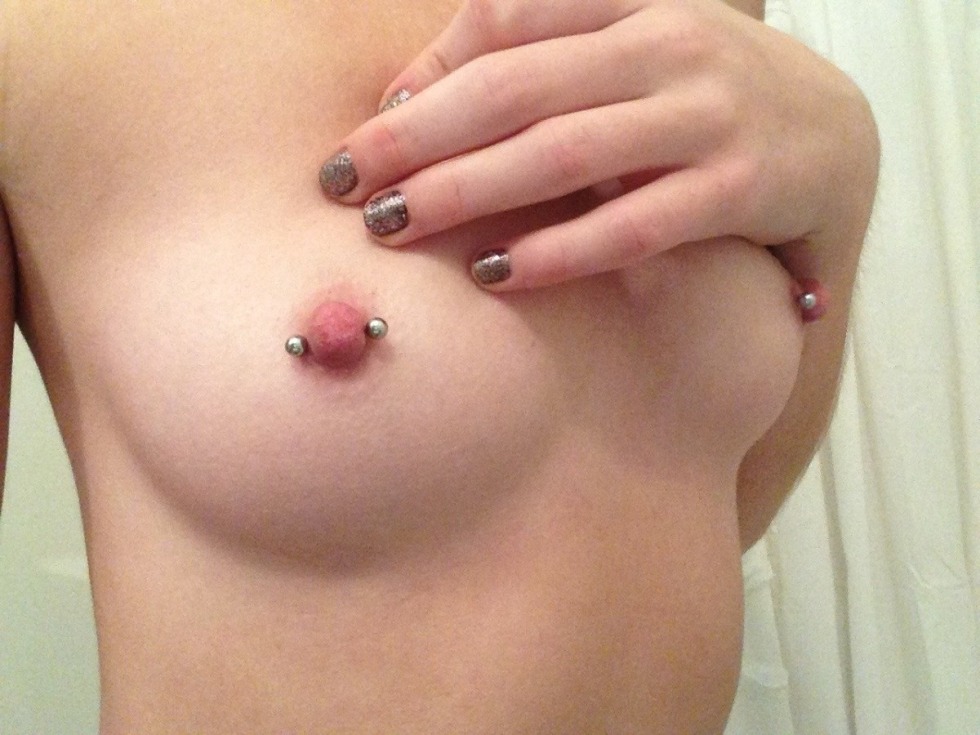 Blonde with pierced nipples