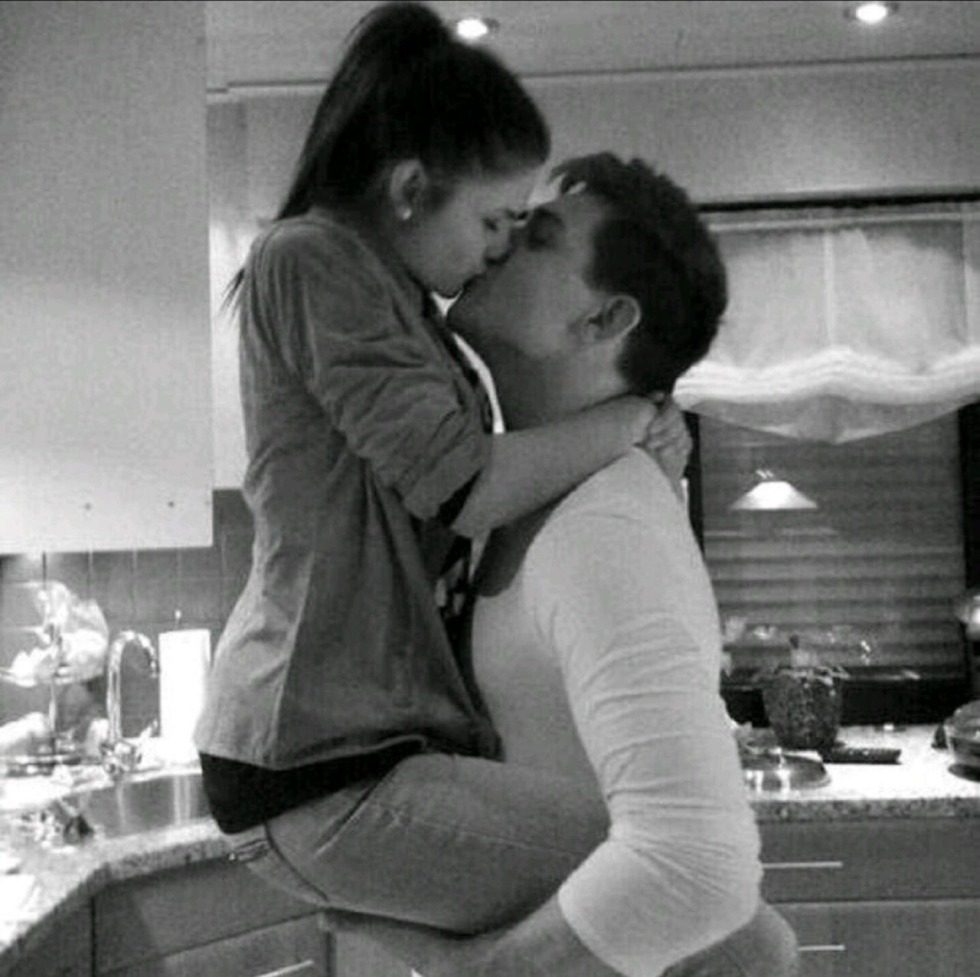 The guy hugs and kisses the girl