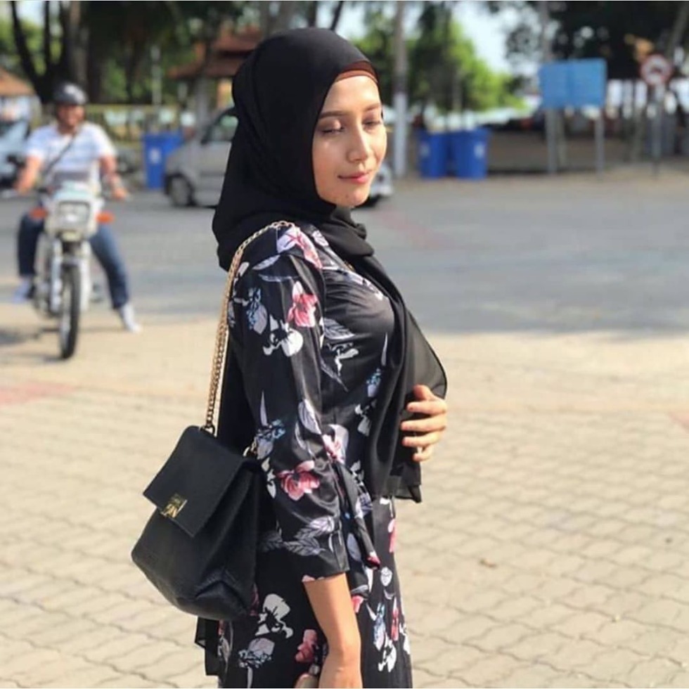 Hijab Girls Group Around the Table