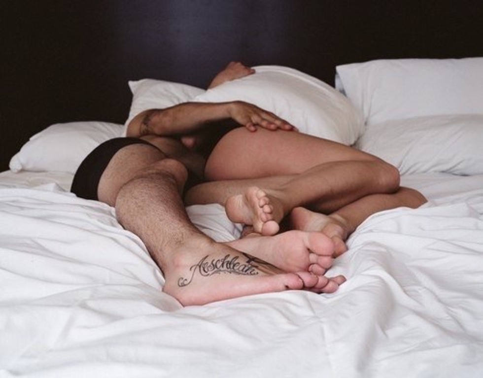 Slender naked in bed