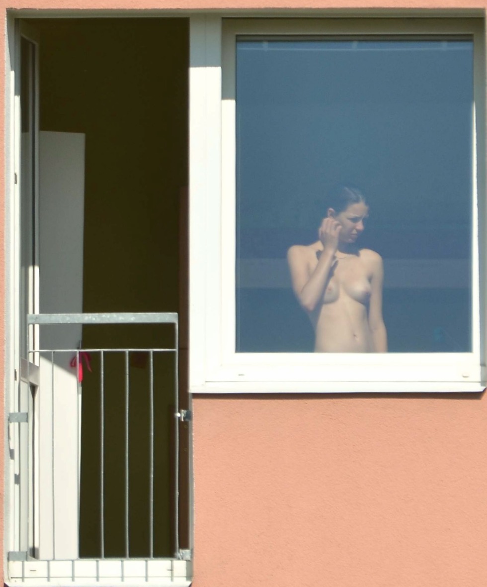 Peeping out the windows behind the naked