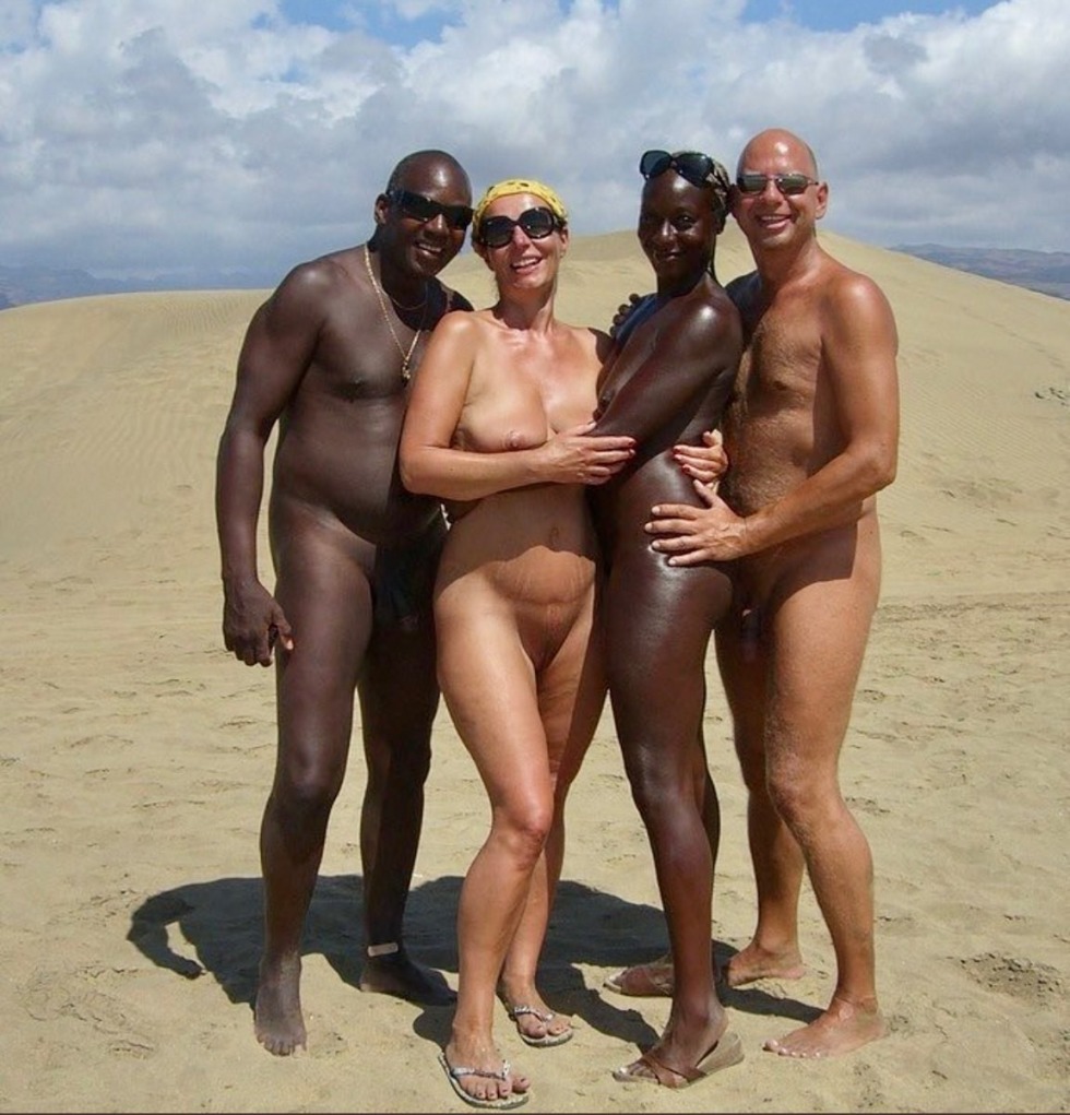 Naked men and women on the beach