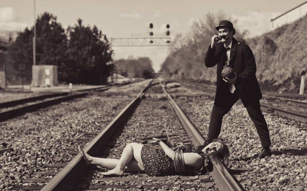Guy and girl on rails