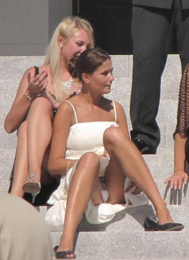 The girl in a short dress bent down