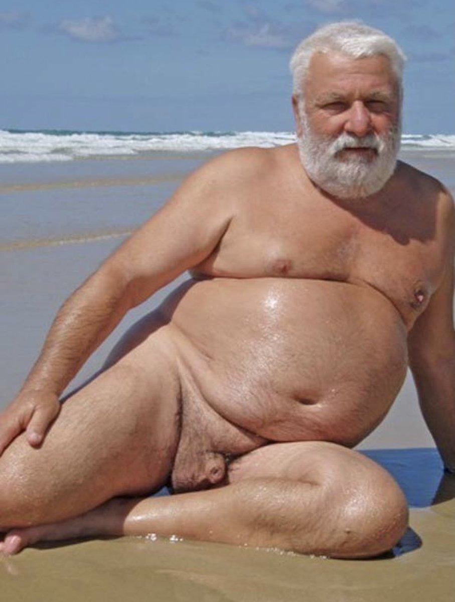 Standing members on a nudist beach