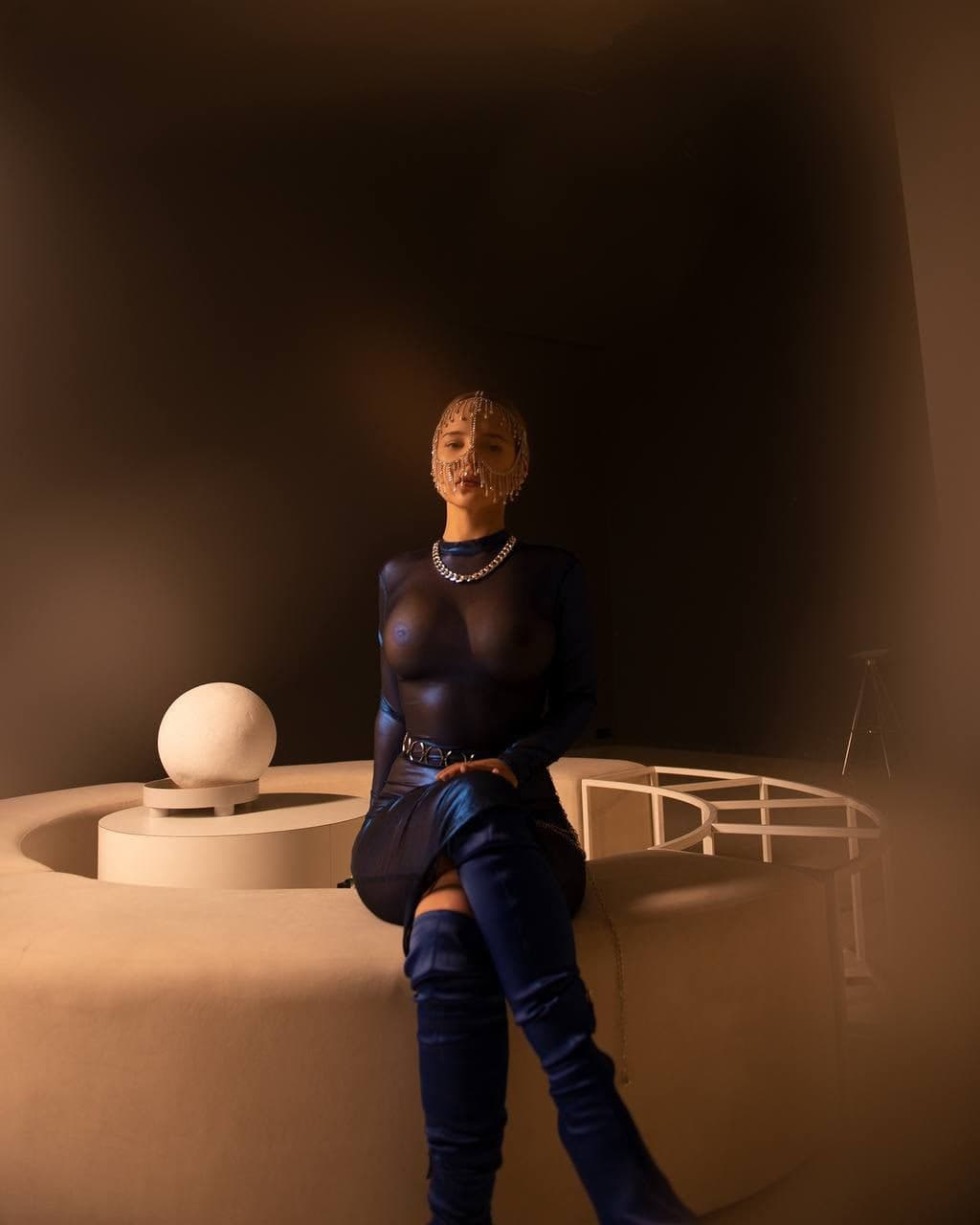 Anissa Kate lies naked on the couch