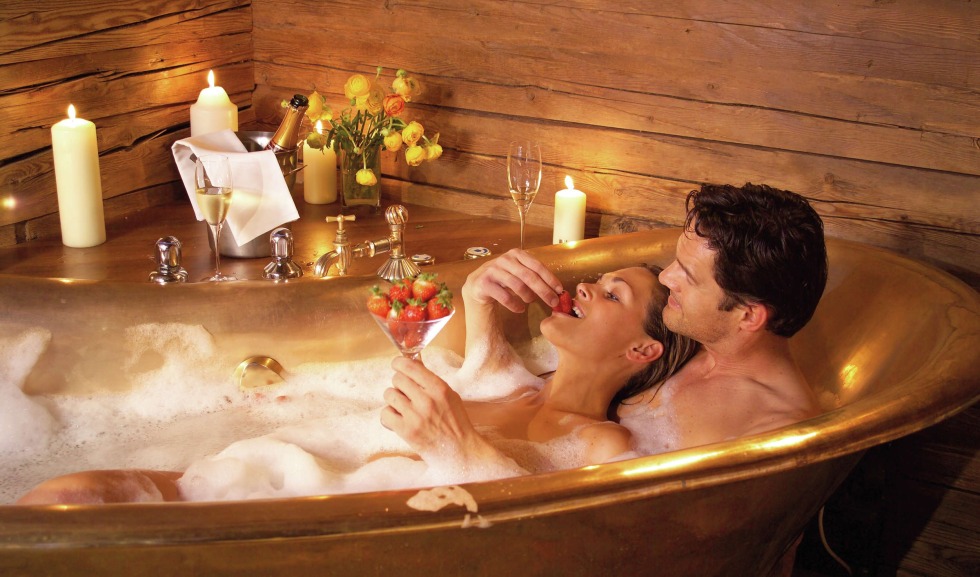 Naked women in a sauna with guys