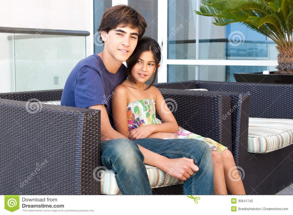 The girl spread her legs under the table