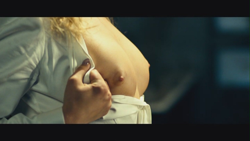 Naked blonde with a tattoo on the leg