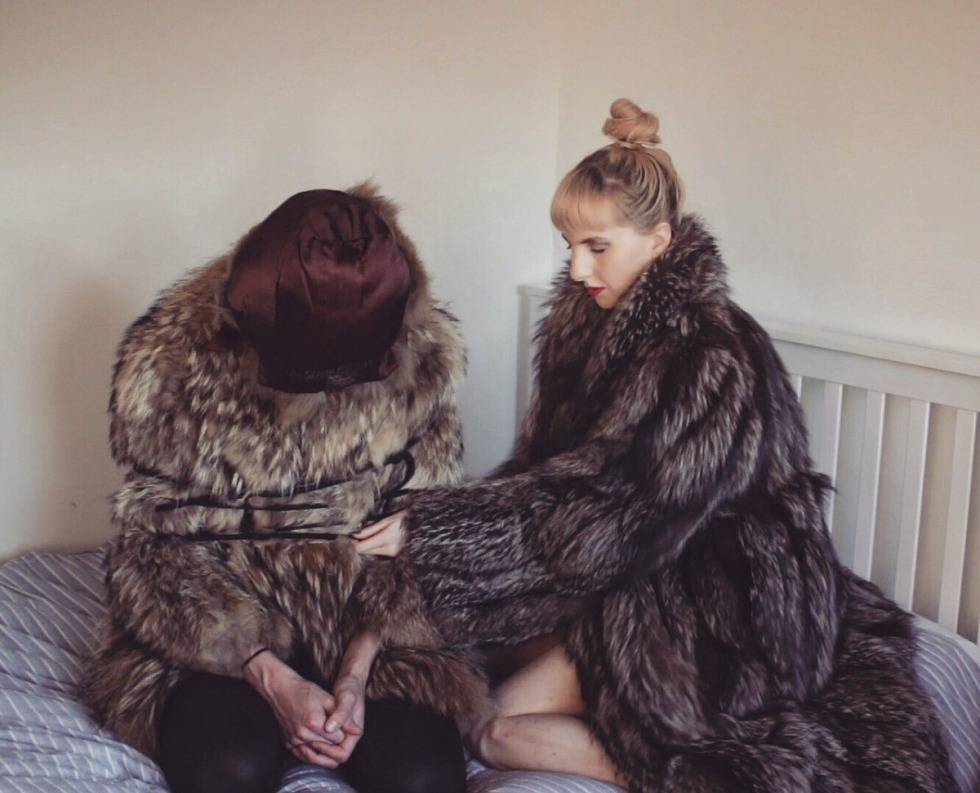 Girl with big breasts in a fur coat