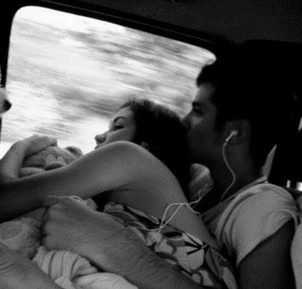 The couple is hugged in the car