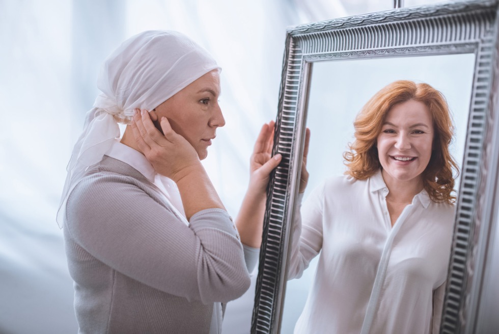 Elderly woman by the mirror