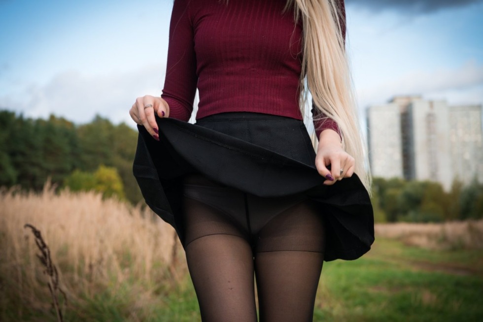 In a mini skirt on the stairs