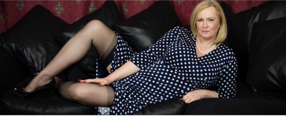 Poses to her husband