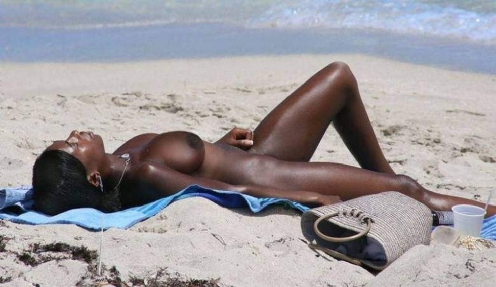 Naked blacks on the beach erection