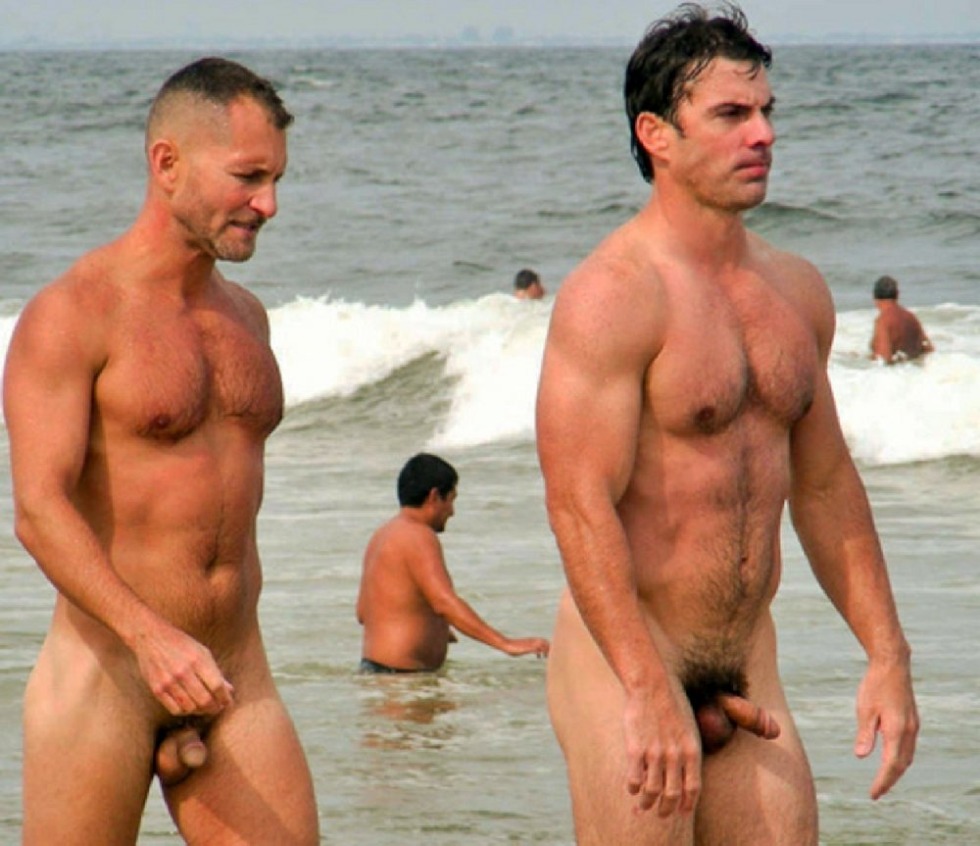 Standing members on a nudist beach