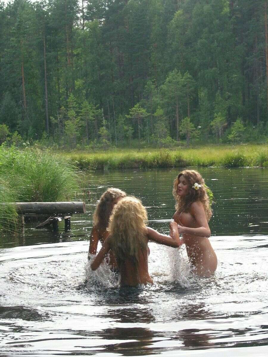 Women swim in the river