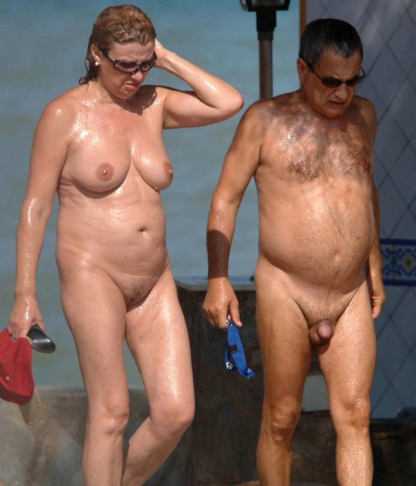 Naked elderly women and men on the beach