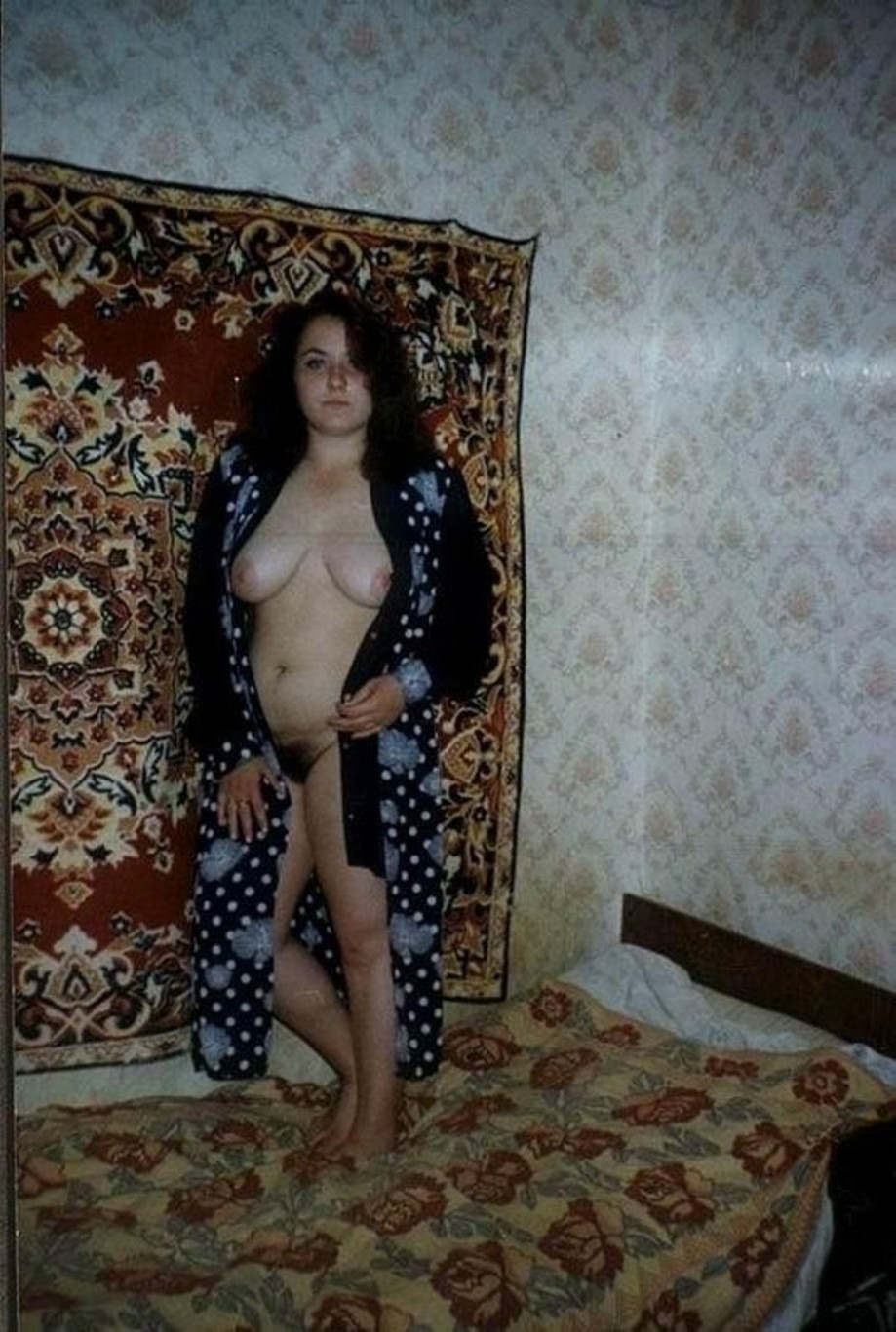 Naked Russian on the background of the carpet