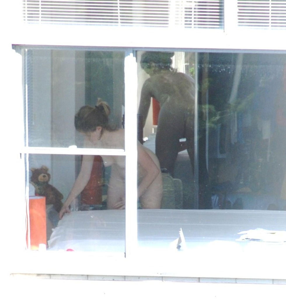 Peeping behind the girls through the window