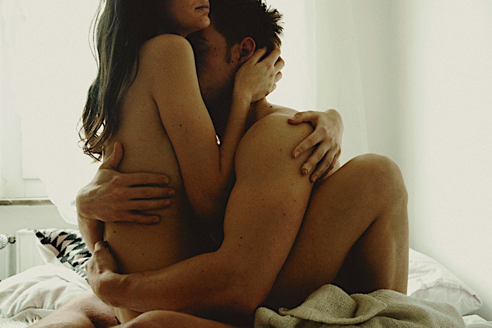 Naked man and woman hug